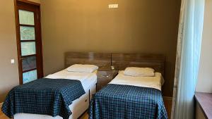 Voodi või voodid majutusasutuse Ivy Boutique Hotel toas