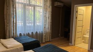 Voodi või voodid majutusasutuse Ivy Boutique Hotel toas