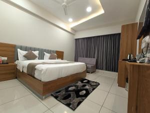 Кровать или кровати в номере HOTEL ASIANA INN