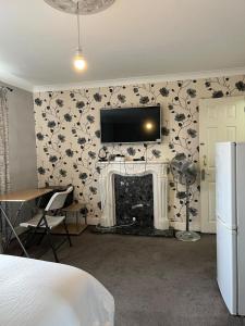 Μια τηλεόραση ή/και κέντρο ψυχαγωγίας στο Oxborne Rooms UK - 22 Seaton