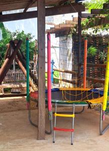 a playground with a table with different colored poles at Casa com piscina e muita tranquilidade in Rio de Janeiro