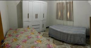 Ένα ή περισσότερα κρεβάτια σε δωμάτιο στο Casa Recanto da Barra