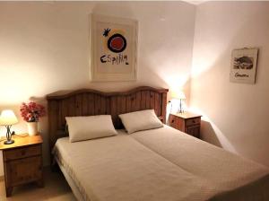 a bedroom with a bed with two pillows on it at LagoVista45 in Torrevieja +17 photos