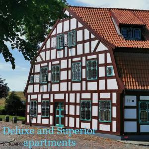 a half timbered building with red and white at Heritage House in Klaipėda