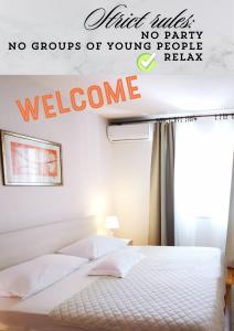 a bed with a sign that says no groups of young people welcome at Apartment D&M1 in Makarska