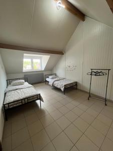 Postel nebo postele na pokoji v ubytování Chez Nadège