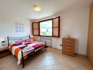 Postel nebo postele na pokoji v ubytování Appartamento nel chianti