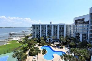 a view of a resort with a pool and a beach at Gulf Shores Surf & Racquet Club 212A in Gulf Shores
