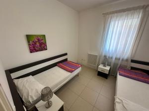 Posteľ alebo postele v izbe v ubytovaní Residence Orate - Agenzia Cocal