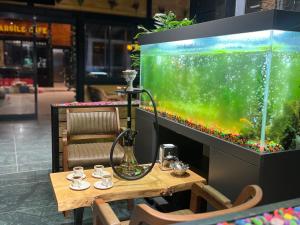 a table and a large aquarium in a restaurant at Aquarium BUNGALOW UZUNGÖL in Uzungöl +71 photos