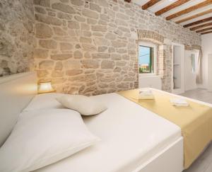 Кровать или кровати в номере Šibenik Style Suites