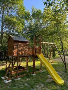 a playground with a slide and a house at Ecopark Tuzlata Екопарк Тузлата in Balchik