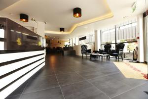 a large lobby with chairs and a waiting room at The Whitechapel in London