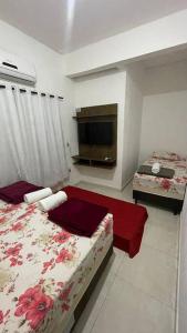 Ένα ή περισσότερα κρεβάτια σε δωμάτιο στο Espaço inteiro - Apto de 1 quarto