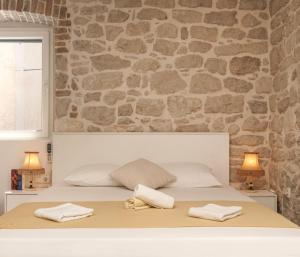 Кровать или кровати в номере Šibenik Style Suites