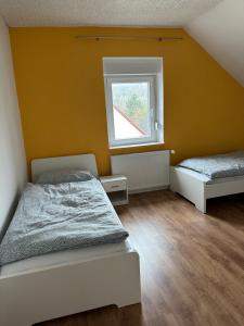 Llit o llits en una habitació de Ankas´s Ferienwohnung