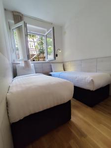 Ένα ή περισσότερα κρεβάτια σε δωμάτιο στο Lucky Apartments +36 φωτογραφίες