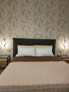 Postel nebo postele na pokoji v ubytování Agape Charme Rooms