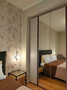 Postel nebo postele na pokoji v ubytování Agape Charme Rooms
