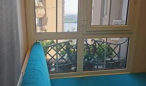 a view of a balcony from a window at Luxury partial Nile view Maadi Cairo apartment in Cairo