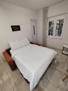 Ένα ή περισσότερα κρεβάτια σε δωμάτιο στο Lucky Apartments