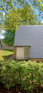 a small house with a window and a roof at L'Écureuil - Terrasses de Malmedy in Malmedy +63 photos