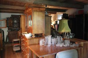 a kitchen with a table with glasses on it at Presshaus Alte Mühle in Stainz