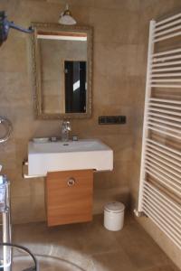 a bathroom with a sink and a mirror at Presshaus Alte Mühle in Stainz