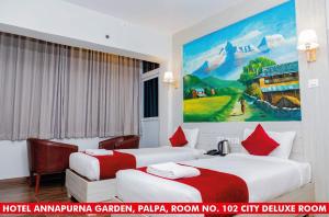 Ένα ή περισσότερα κρεβάτια σε δωμάτιο στο Annapurna Garden palpa