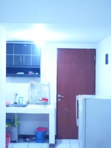 Kuchyň nebo kuchyňský kout v ubytování Apartement Buah Batu Park