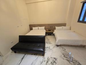 Ένα ή περισσότερα κρεβάτια σε δωμάτιο στο 眠極文旅-無人化民宿