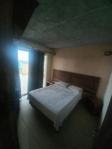 Ένα ή περισσότερα κρεβάτια σε δωμάτιο στο Pousada Casarinha