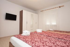 Postel nebo postele na pokoji v ubytování Holiday Home Luka Pridraga