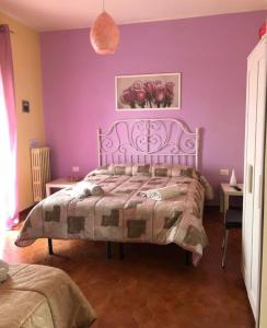 Postel nebo postele na pokoji v ubytování B&B da Cinzia
