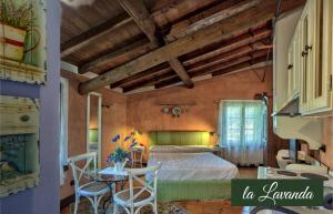 a bedroom with a bed and a table and chairs at Il Borghetto Vacanze nei Mulini in Valeggio sul Mincio