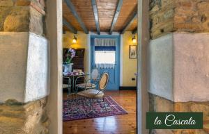 a hallway of a house with a table and chairs at Il Borghetto Vacanze nei Mulini in Valeggio sul Mincio