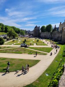 a group of people walking in a park at appartement au calme in Vannes