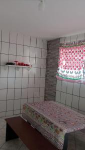 Giường trong phòng chung tại Casa a 300 metros do Santuário
