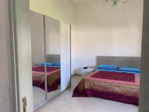 Postel nebo postele na pokoji v ubytování FLAVIO RELAX