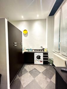 a kitchen with a washing machine in a room at Old Town Portofino Coast in Rapallo