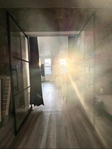 a room with the sun shining through a window at 3 bedroom Condo in Central Park/ Times Square/ Hudson Yards in New York