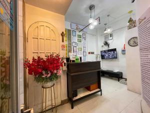 a store with a flower arrangement next to a door at Chanel Paris Hotel powered by Cocotel in Manila