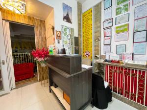 a restaurant with a cash register in a room at Chanel Paris Hotel powered by Cocotel in Manila +45 photos