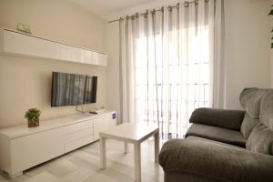 Televízia a/alebo spoločenská miestnosť v ubytovaní Bonito apartamento cerca de la playa de Torrox