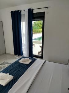 Postel nebo postele na pokoji v ubytování Apartman Vito
