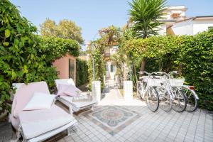 a patio with bikes parked next to a building at Villa Lola - Liberty Dreamscape in Viareggio