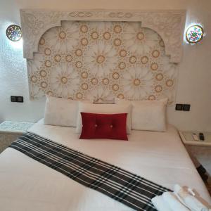 En eller flere senger på et rom på Golf Stinia hôtel & Spa