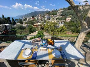 a table with a plate of food on top at B&B Casetta del Marinaio in Camogli