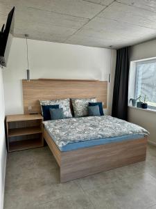 מיטה או מיטות בחדר ב-Ubytování Pod Cimburkem