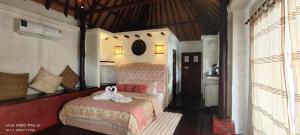 a bedroom with a bed with a white bow on it at Clear View Resort in Koh Tao